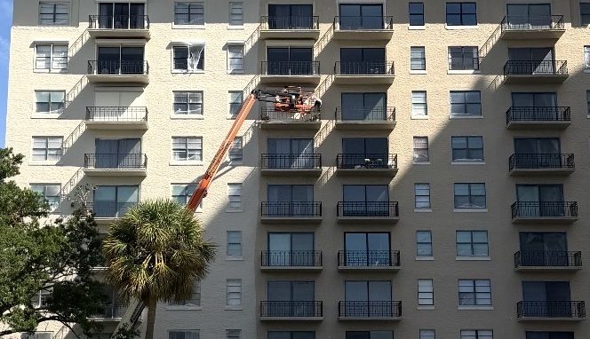 Boom lift access during the Bayshore Royal high-rise condo repaint