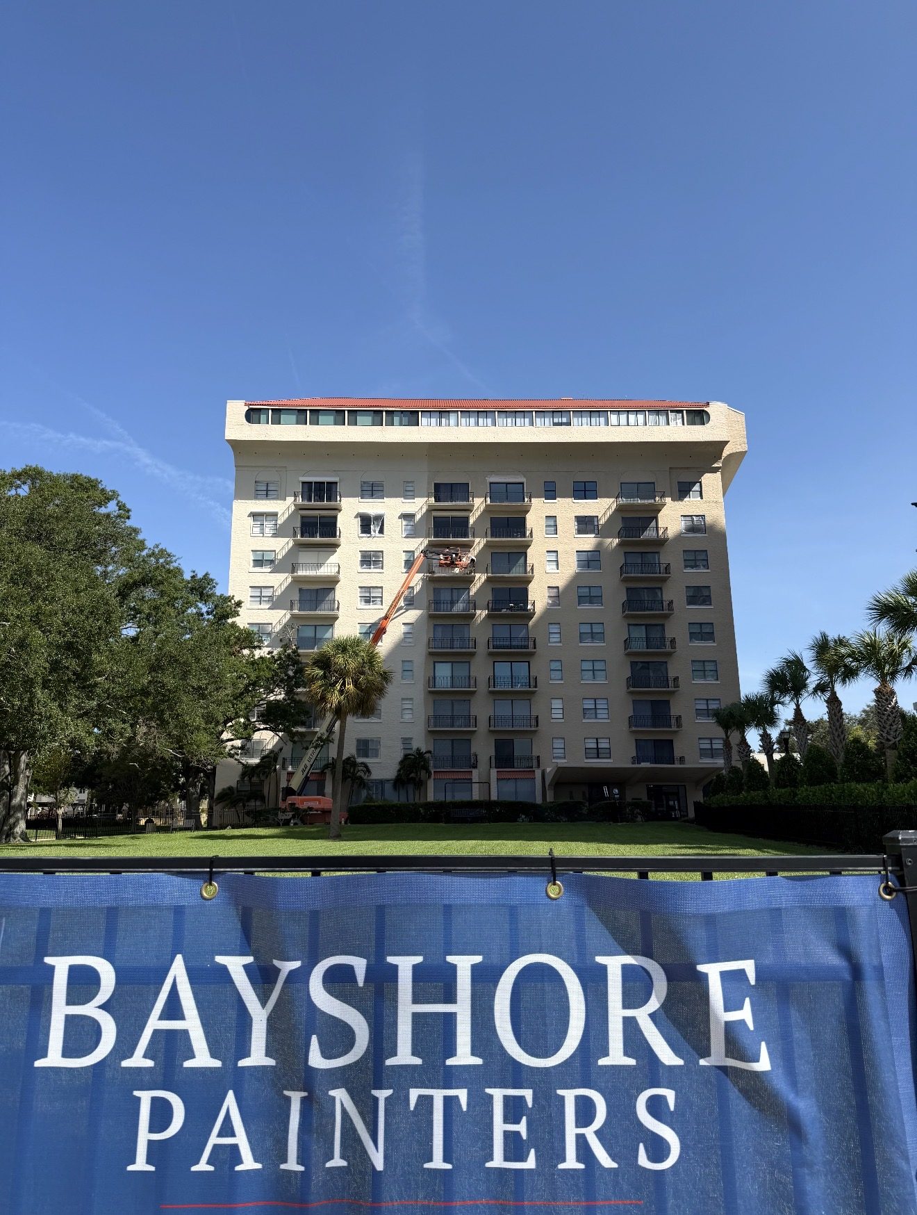 Bayshore Painters banner on site during the Bayshore Royal condo exterior repaint in Tampa