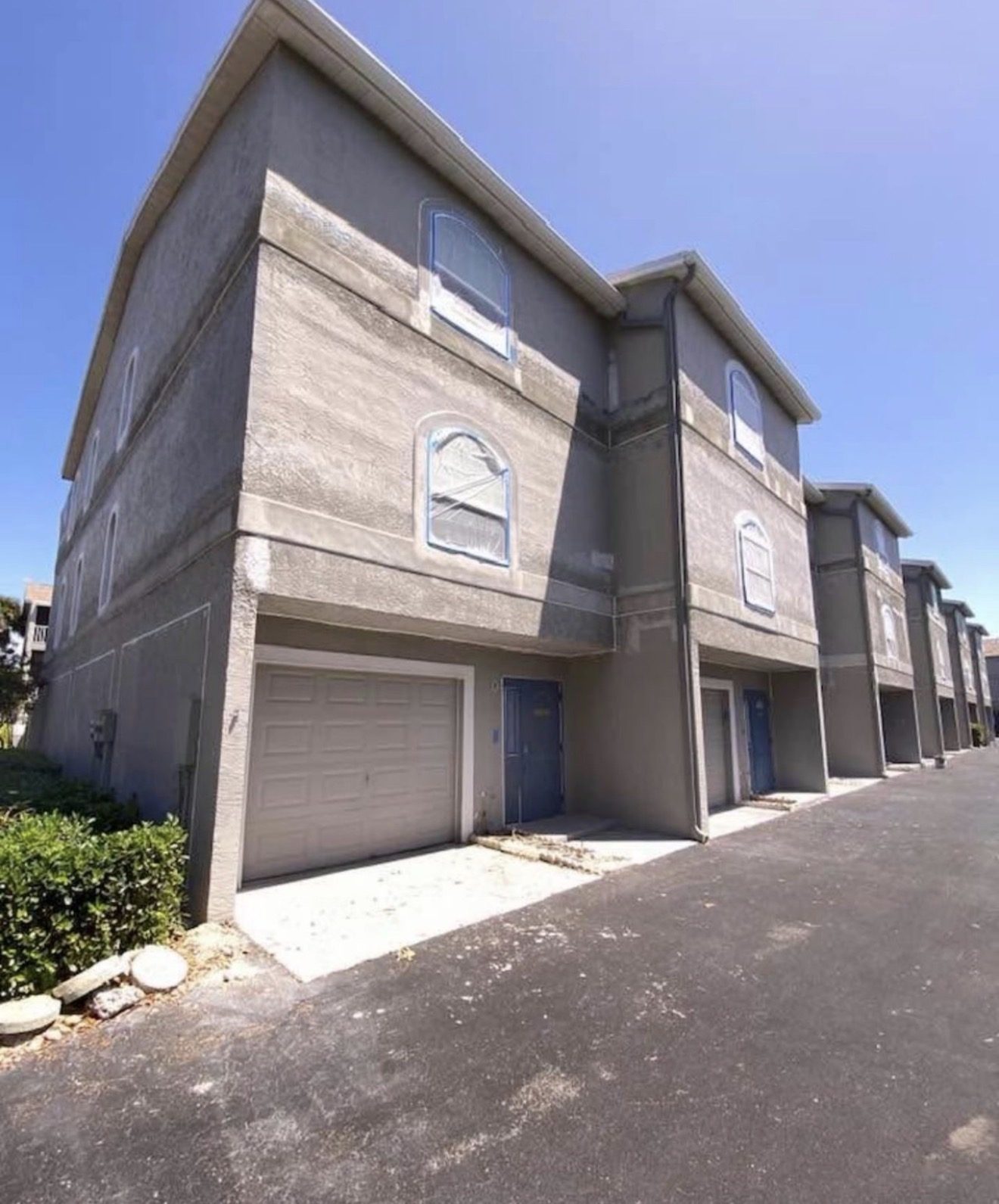 Dolphin Watch townhomes during prep, windows masked before painting