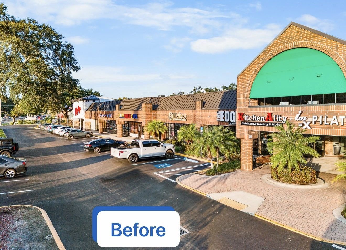 Grand Plaza Shopping Center before repaint, red brick facade