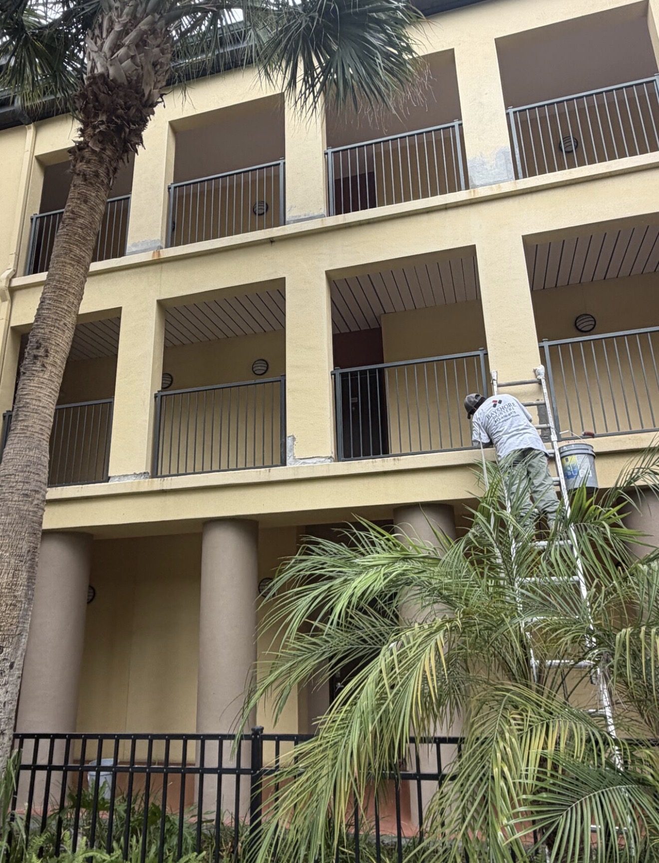 Bayshore Painters crew working on balconies at Madison SoHo condominium, Tampa